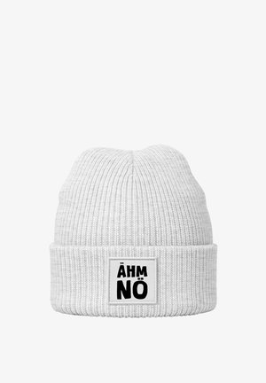 White knit beanie with ribbed texture and a folded cuff. Features a rectangular label with the text “ÄHM NÖ” in bold black letters.