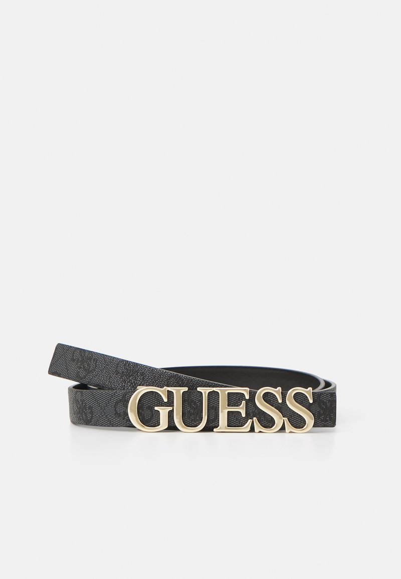 Ceinture en simili cuir noir avec logo "GUESS" en ton or, présentant une texture lisse et un design mince et minimaliste.