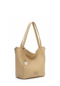 Beige leather tote bag with a textured finish, two shoulder straps, and a silver accent tag. Features a soft, curved shape.