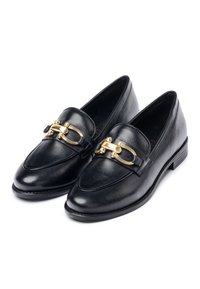 Black leather loafers featuring a gold horsebit detail on the front, rounded toe, and a low stacked heel. Smooth texture and minimal design.