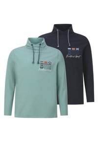 Two long-sleeve pullovers: one in light green with a high collar and logo details, one in navy blue with similar design and accents.