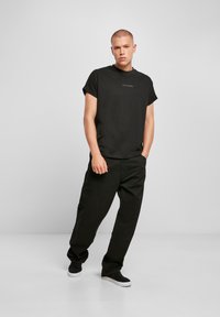 Urban Classics T-shirt print - schwarz