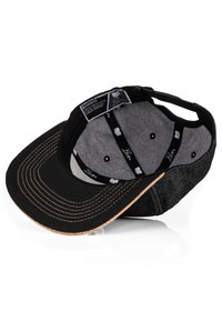 Black and gray cap with a curved brim and brown underside, featuring decorative stitching and inner labels with a shell logo pattern.