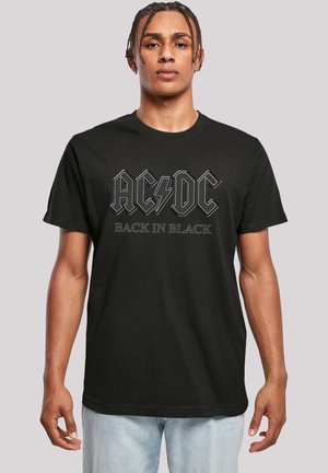 Black cotton t-shirt featuring "AC/DC" logo and "BACK IN BLACK" text in bold typography. Classic crew neck and short sleeves.