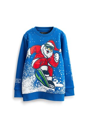 Blauwe trui met een afbeelding van de Kerstman die groene skibril draagt en snowboardt door vallende sneeuw.