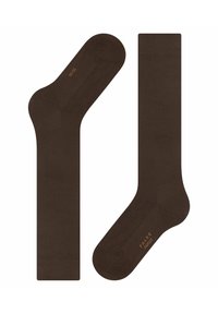 Brūnas kokvilnas zeķes ar gludu tekstūru, ar ribotu malas un pastiprinātu papēdi. "FALKE FAMILY" izdrukāts oranžā krāsā uz sāna.