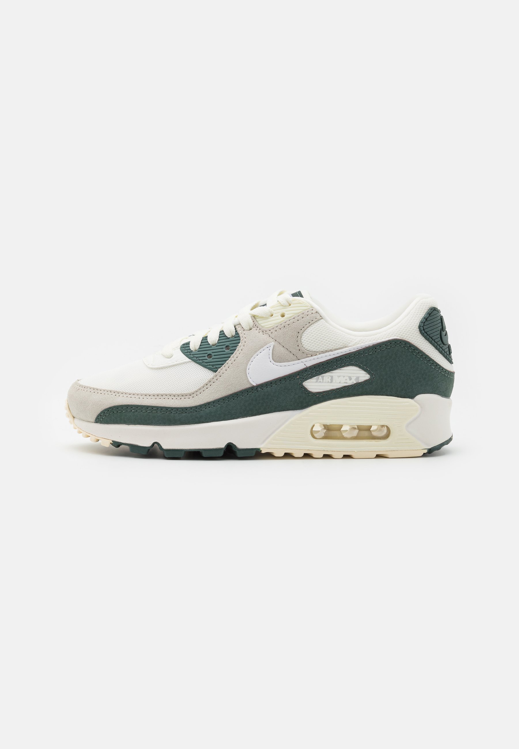 white and green nike trainers