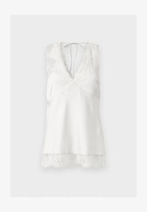 Valge varrukateta satiinist kämpsun pitskaunistusega V-kaelusel ja äärel, taga kaelusel paela kinnitusega.