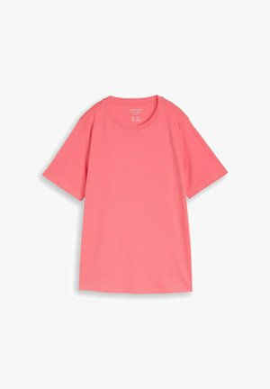 Jednostavna majica s kratkim rukavima u boji koralja, ravno položena na bijelu pozadinu, izrađena od pamuka s ležernim krojem.