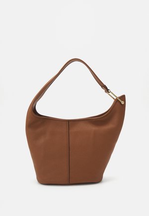 Brown leather hobo bag with a curved top and smooth texture, featuring a gold accent on the strap and a clean, minimal design.