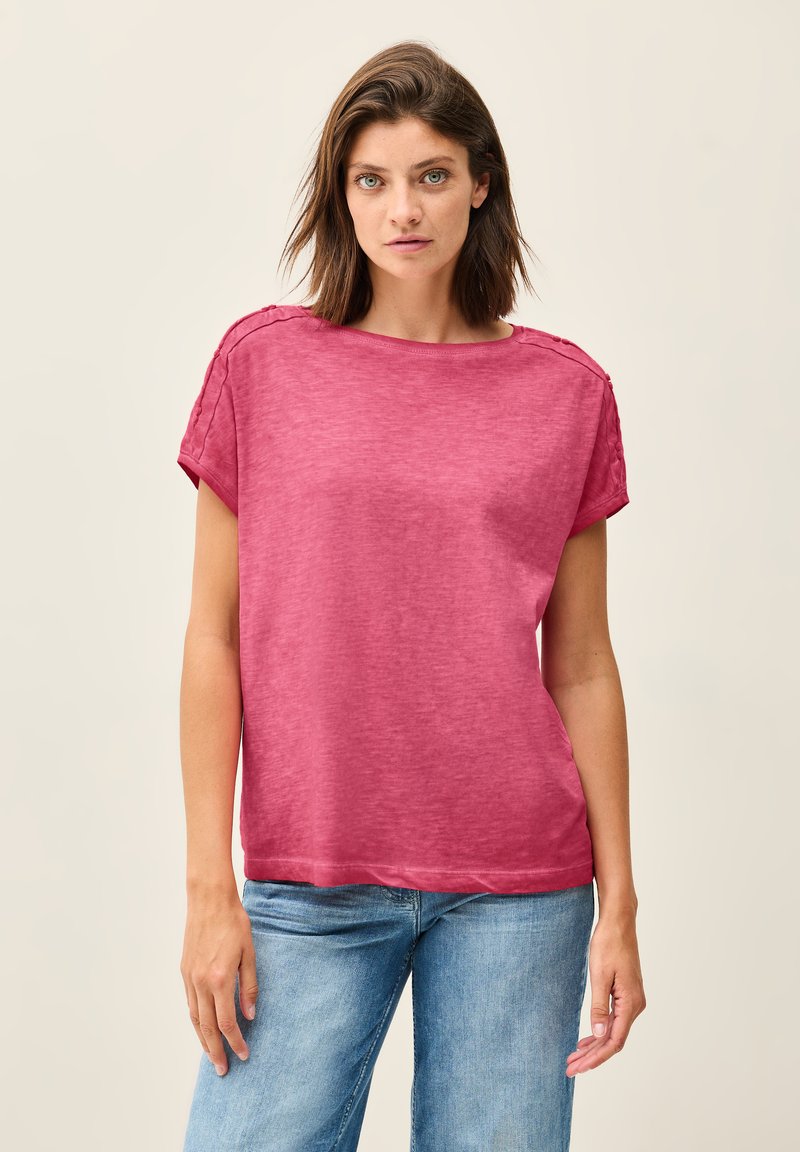 Fuchsia short-sleeve t-shirt in a relaxed fit, crafted from soft fabric with a subtle texture. Features rolled sleeves and a wide neckline.