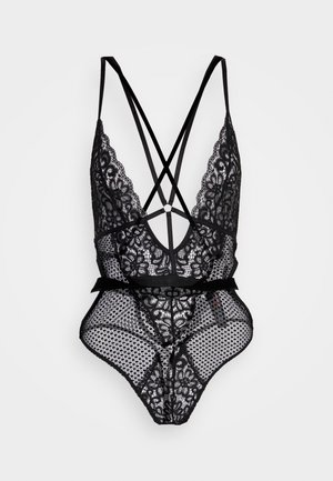 Black lace bodysuit featuring a deep V-neck, crossback straps, floral pattern, dotted mesh, and a satin tie at the waist.