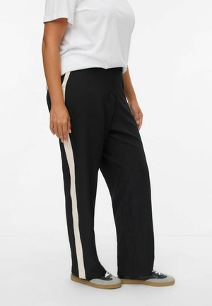 Schwarze weite Hosen mit cremefarbenen Seitenstreifen; aus weichem Material gefertigt, mit relaxed Fit, elastischem Bund und minimalistischem Design.
