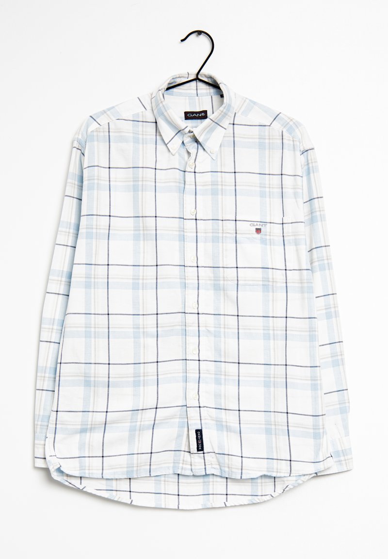 Camisa de cuadros de manga larga y ligera en blanco y azul claro, con collar abotonado, bolsillo en el pecho y dobladillo curvado. Logo de la marca visible.