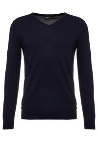 Marinblå v-ringad tröja i mjukt material, med långa ärmar och ribbade muddar och nederkant för en figurnära silhuett.