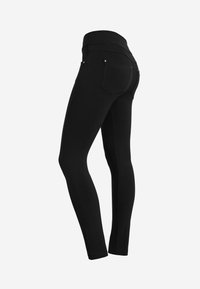 Leggings neri con una cintura elastica, design slim-fit, dotati di due tasche posteriori e una texture liscia.