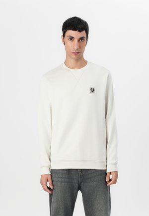 Crewneck sweatshirt in off-white cotton blend, features a small black logo patch on the left chest, ribbed cuffs, and hem.