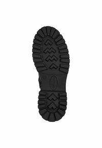 Black rubber boot sole featuring deep treads, zigzag pattern, and reinforced edges, designed for traction and durability.