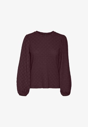 Blouse longue à manches longues de couleur bordeaux avec un col rond et des manches bouffantes. Le tissu présente un motif légèrement en relief. Coupe droite.