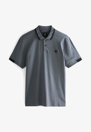 Gray polo shirt with a black collar and shoulder accents. Features a textured fabric and a small logo on the chest. Short sleeves.