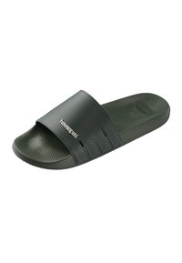 Sandale Havaianas mules vert foncé avec semelle texturée et large brides présentant un motif en relief ainsi qu'un logo de marque blanc.