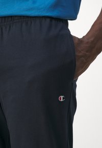 Champion ICON ELASTIC CUFF PANTS - Tepláky - navy