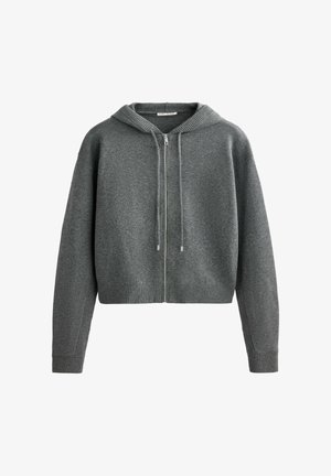 Šedá mikina na zip z texturované látky, s žebrovanými manžetami a lemem, volným střihem a nastavitelnými šňůrkami na kapuci.