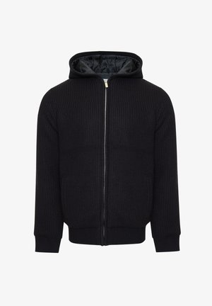 Felpa nera con cappuccio, zip e texture a costine, dotata di due tasche laterali e una fodera liscia. Caratterizzata da polsini e orlo aderenti.