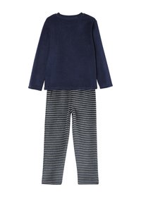 Navy long-sleeve top paired with gray and navy horizontal striped pants, shown from the back on white background.