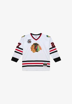 White hockey jersey with black, red, and green accents. Features a large logo, number 27 on the sleeve, and a tag near the hem.