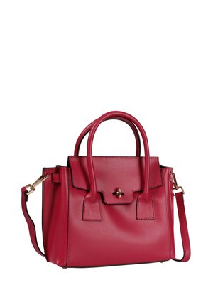 Red leather handbag with dual top handles, front flap with gold twist-lock, and detachable shoulder strap against white background.