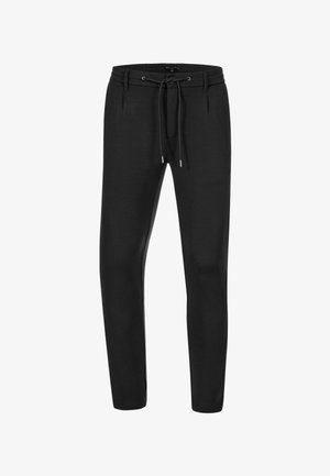 Schwarze, taillierte Sweatpants aus weichem Material, mit einem Kordelzugbund, seitlichen Taschen und einer glatten Textur.