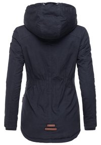Navy blue hooded jacket made of durable fabric with elastic waist, side pockets, and a longer back. Features logo patches at the hem.