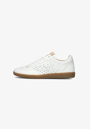 White athletic shoes with a perforated design, round toe, and textured upper. Features a gum rubber sole and subtle branding on the tongue.