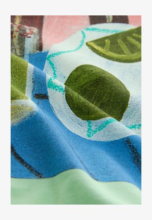 Patterned fabric featuring abstract shapes in green, blue, and white shades with a smooth texture and vibrant colors.