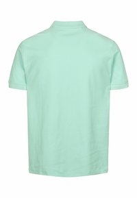 Mentazöld, rövid ujjú pólóing, amely pamutból készült, klasszikus gallérral és letisztult, egyszerű dizájnnal, egyenes alsó szegéllyel.