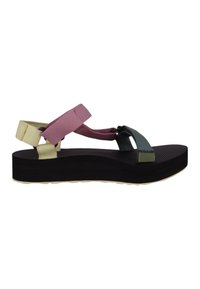 Sandales à lanières avec des bandes élastiques roses, vertes et jaunes, une semelle noire texturée et un design de plateforme plate.