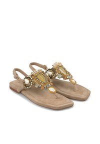 Beige suède sandalen met een platte zool, voorzien van een beaded ornament ontwerp in goud, crème en mintgroen op de banden.