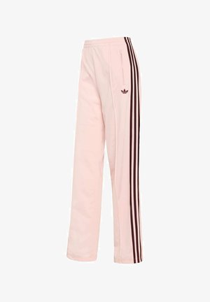 Roze trainingsbroek met zwarte zijstrepen, elastische tailleband en een klein logo; gemaakt van een gladde, lichte stof.