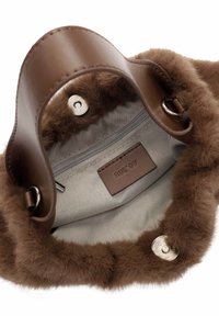 Brown faux fur handbag with a smooth brown leather grip, gray interior lining, snap closure, and branded tag.