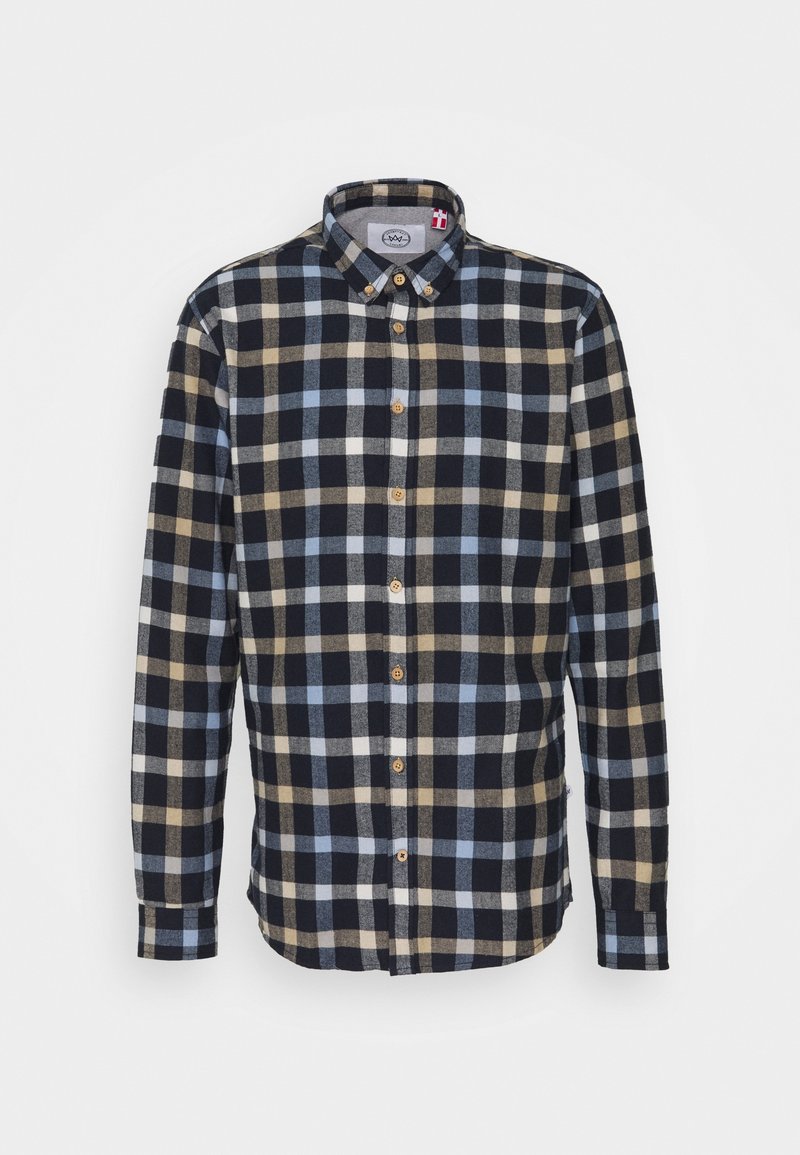 Camicia in flanella con colletto a bottone, caratterizzata da un motivo a quadri in blu navy, azzurro chiaro e beige. Tessuto morbido, maniche lunghe e bottoni in legno.