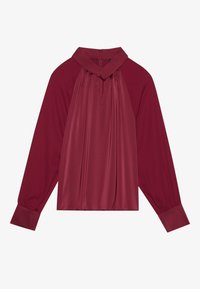 Blusa borgogna con maniche lunghe, caratterizzata da un alto colletto, pieghe sul davanti e chiusura con zip sul retro; tessuto dalla texture liscia.