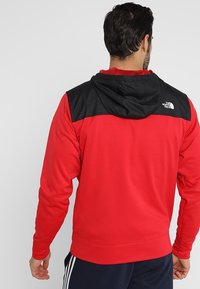 The North Face Fleecová bunda - red
