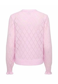 Jersey de punto rosa con un patrón de diamantes, mangas largas, puños acanalados y un escote redondeado. Texturizado con un trabajo de puntada aireado en todo.