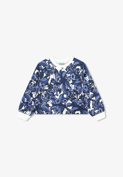 Sweat-shirt à motif floral avec des designs bleu marine et bleu sur un fond blanc, avec des poignets et un col côtelés. Étiquette de marque visible.