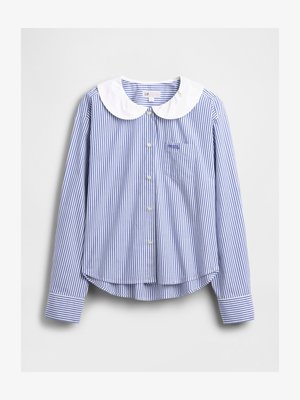 Blå og hvidstribet skjorte med knapper og en kontrasterende hvid Peter Pan-krave, lange ærmer og en brystlomme. Struktureret stof.