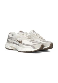 Lightweight white athletic shoes with gray accents, mesh and synthetic material, rounded toe, cushioned sole, and a branded logo on the side.