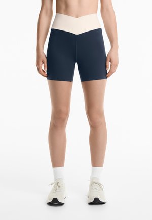 OYSHO PERFECT-ADAPT HIGH-RISE 10CM HOT PANT V-CUT WAIST - Leggings - Trousers - dark blue