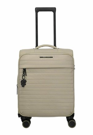 Valigia beige in morbida fodera con trapuntatura orizzontale, manico telescopico nero, tasca frontale con cerniera, quattro ruote nere girevoli e portachiavi nero a forma di trifoglio.
