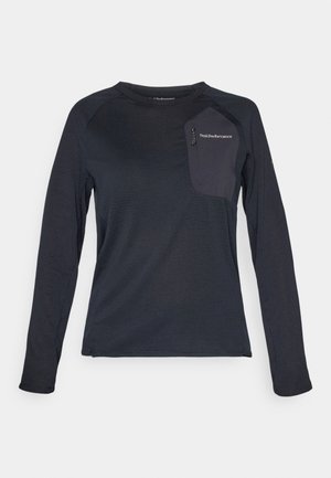Camicia tecnica a maniche lunghe di un blu navy scuro, con un corpo testurizzato, tasca in tessuto a contrasto e logo Peak Performance sul petto.
